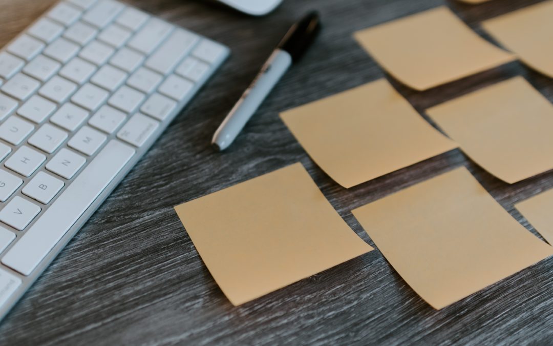 Sticky notes arranged by a computer keyboard for creative brainstorming